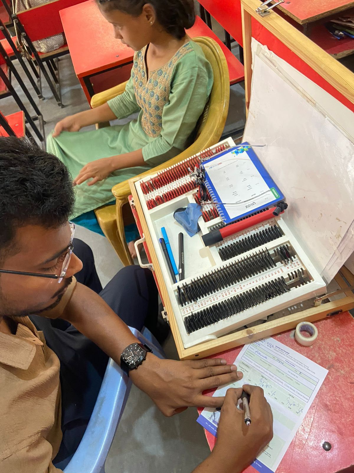 Medical professionals carrying out vision assessments.